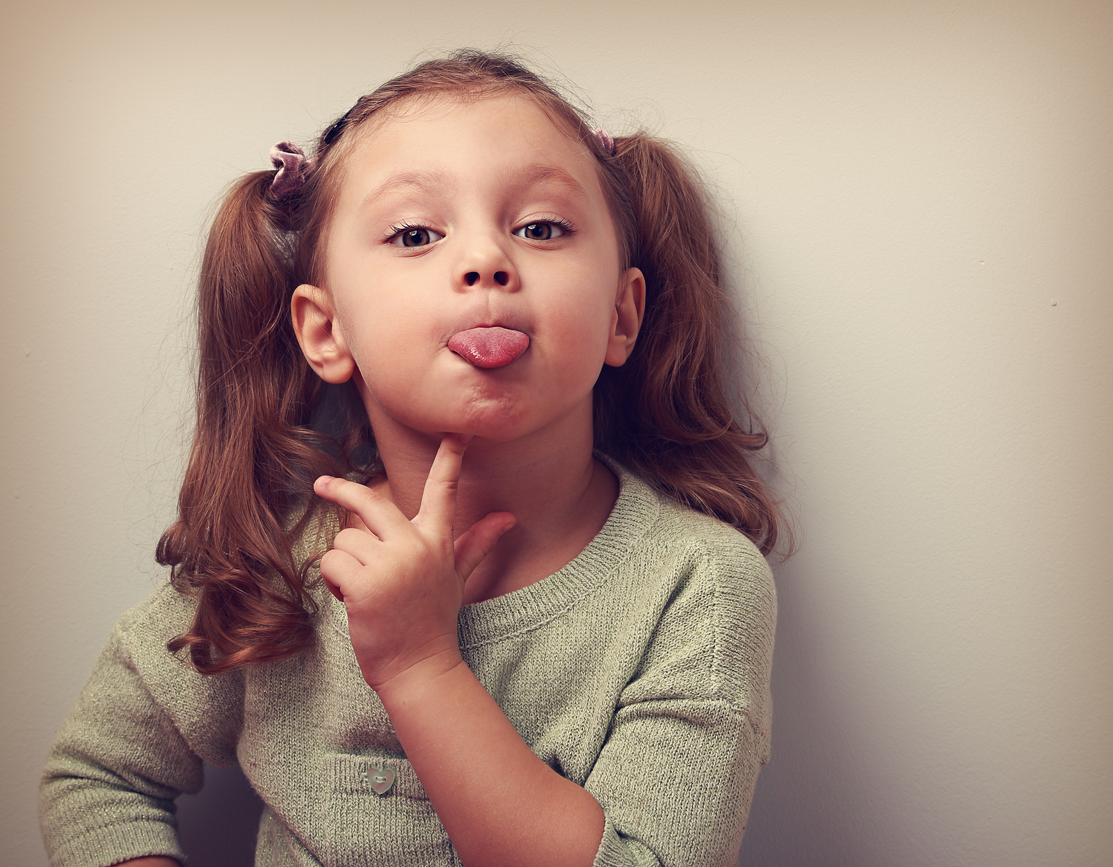 bigstock Thinking Grimacing Girl Showin 87476612