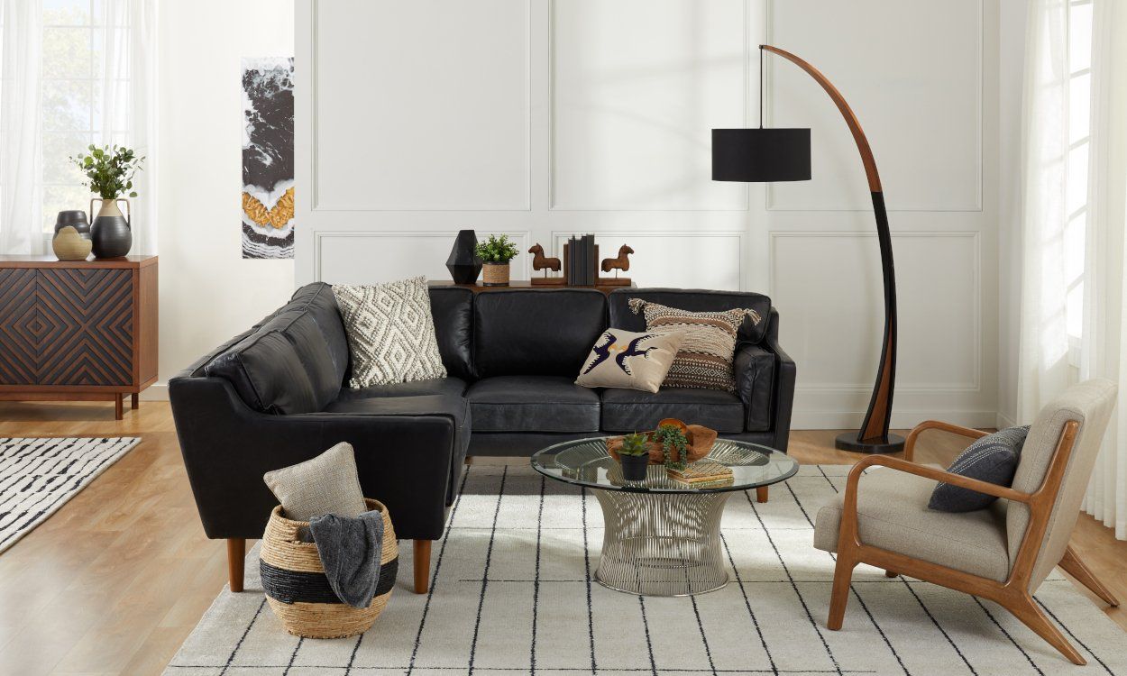 cómo decorar una sala de estar con muebles negros