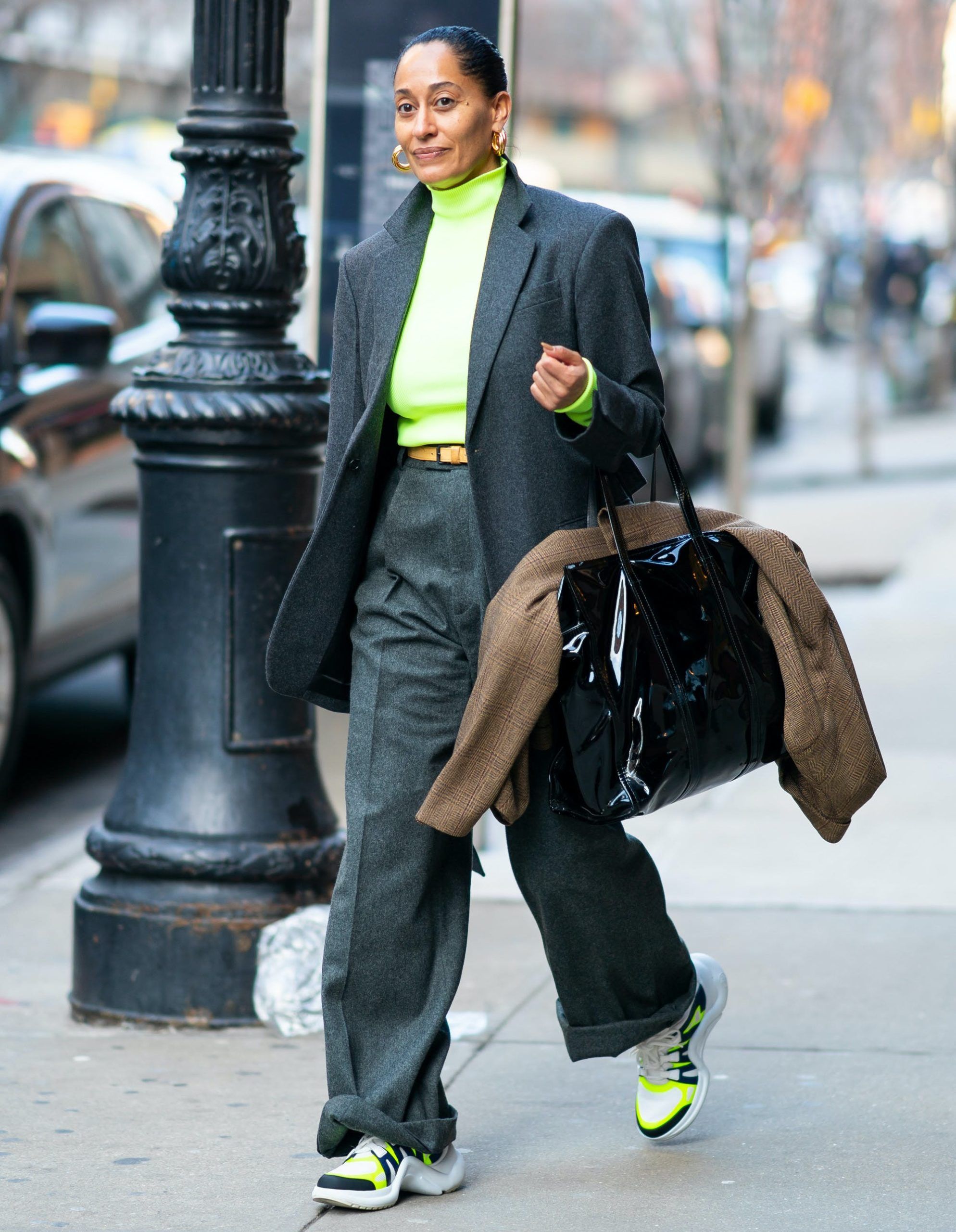 tracee ellis ross wearing a gray suit with neon scaled