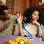 apologetic african american male holding hand his chest trying convince mad woman his fidelity black female ignoring her unfaithful husband s excuses love relationships problems