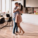 man and woman dancing in modern interior