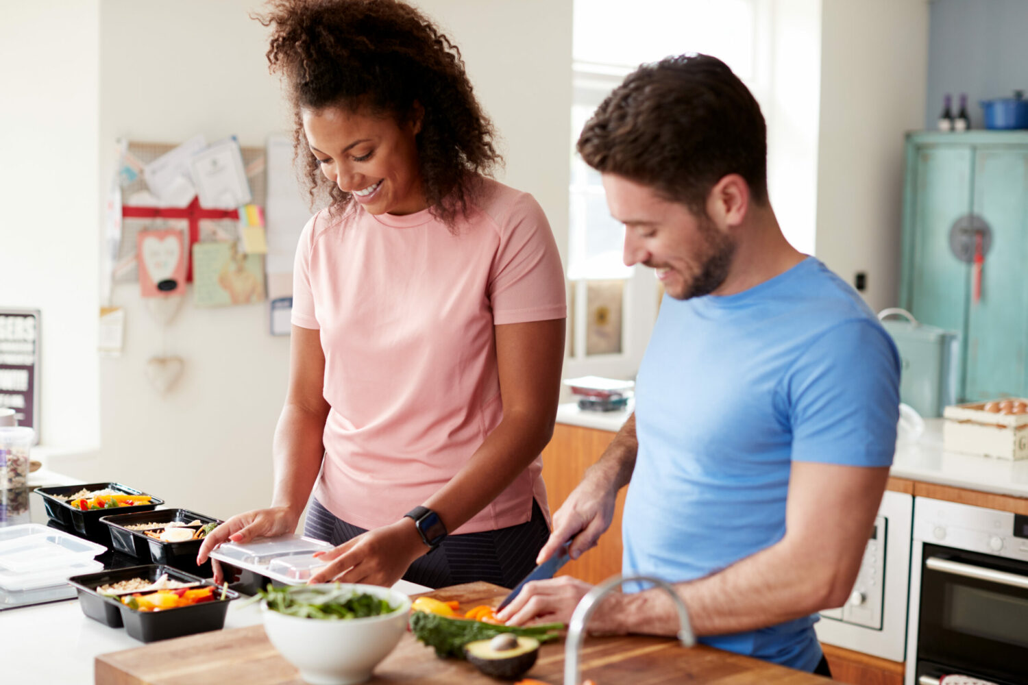 Couple prepping meals together scaled 1